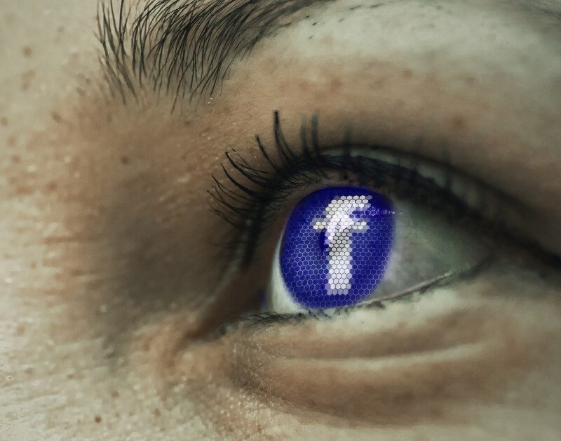 digitally altered eye with facebook logo inferring deepfakes