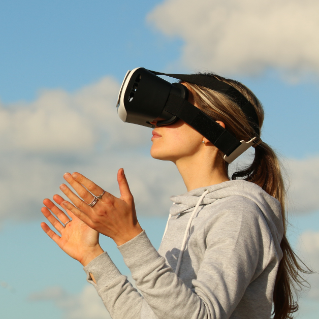 person using a virtual reality headset outside