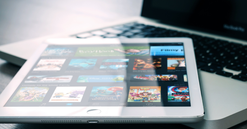 tablet on laptop symbolizing screen time monitoring